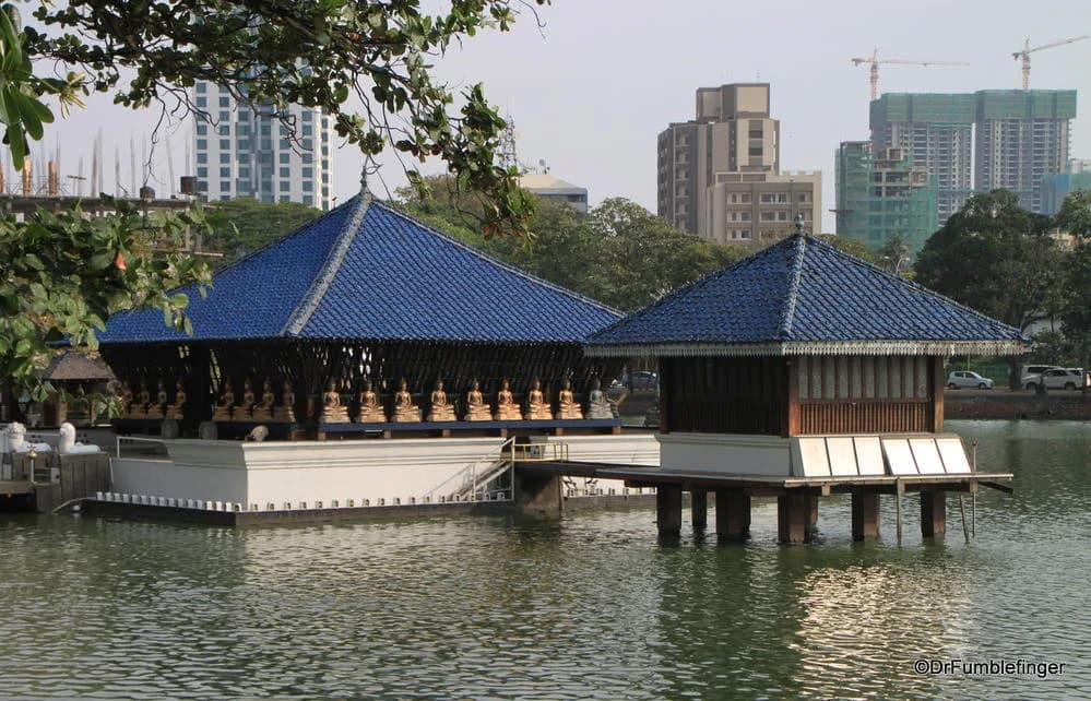 Seema Malaka Temple floating on Beira Lake with blue roofs and Buddha statues, Colombo
