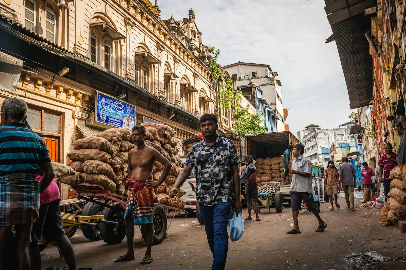 Busy market street in Colombo, Sri Lanka with locals and traders going about their day