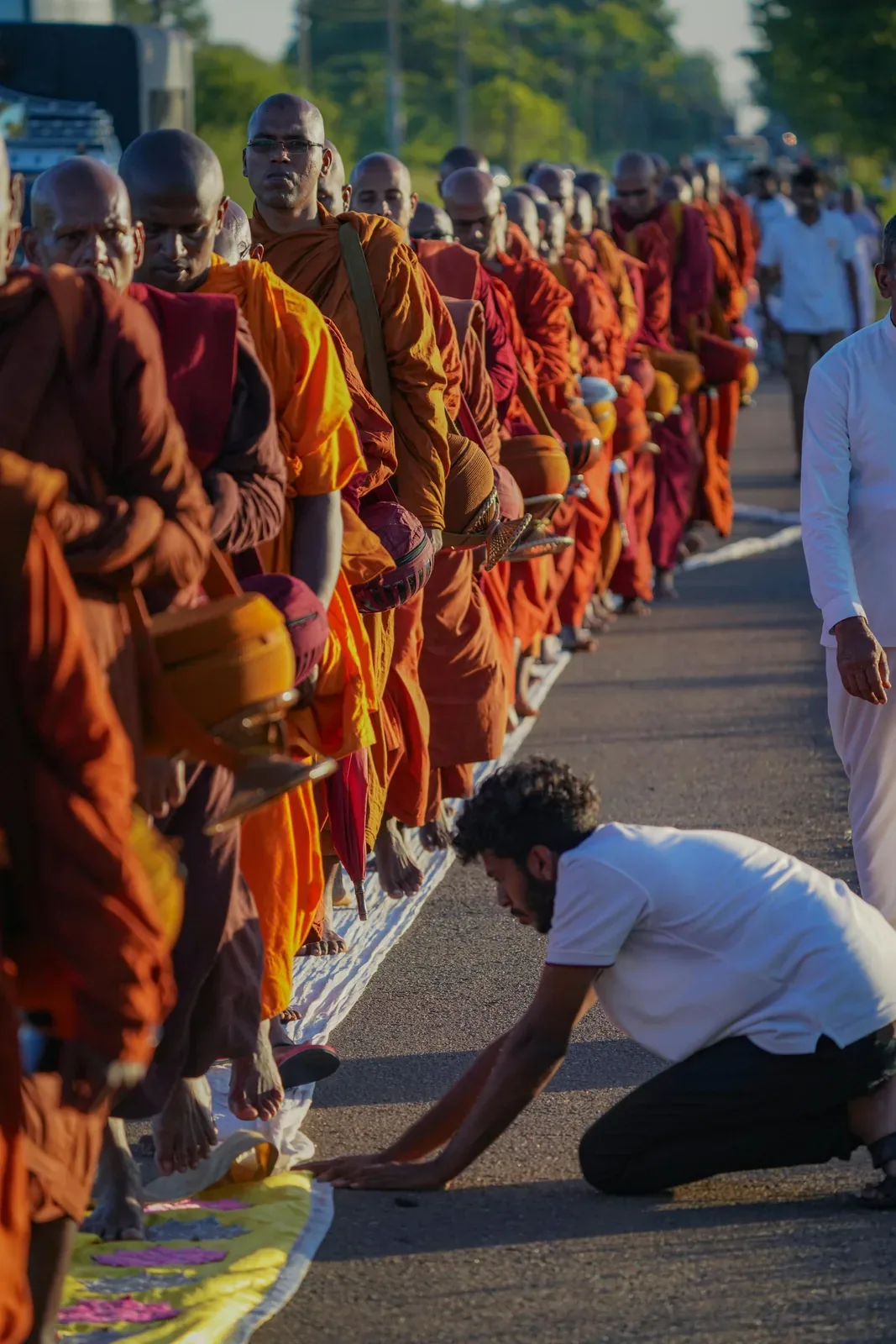 Buddhist monks and pilgrims in a ceremonial procession in Sri Lanka, representing the sacred pilgrimage culture
