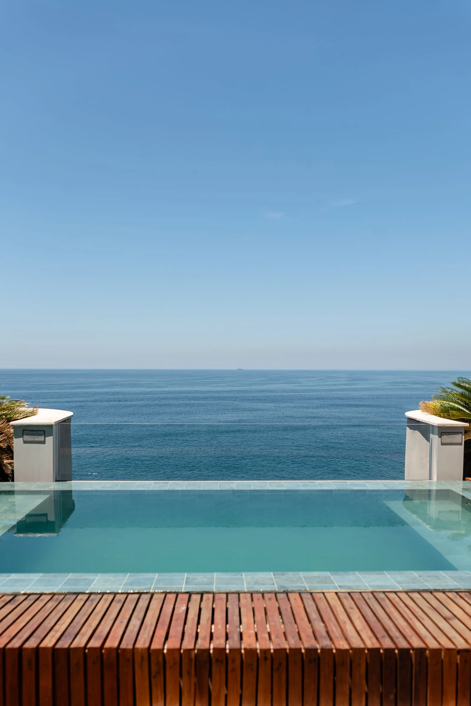 Infinity-edge pool merging into the ocean horizon at a south coast Sri Lanka resort