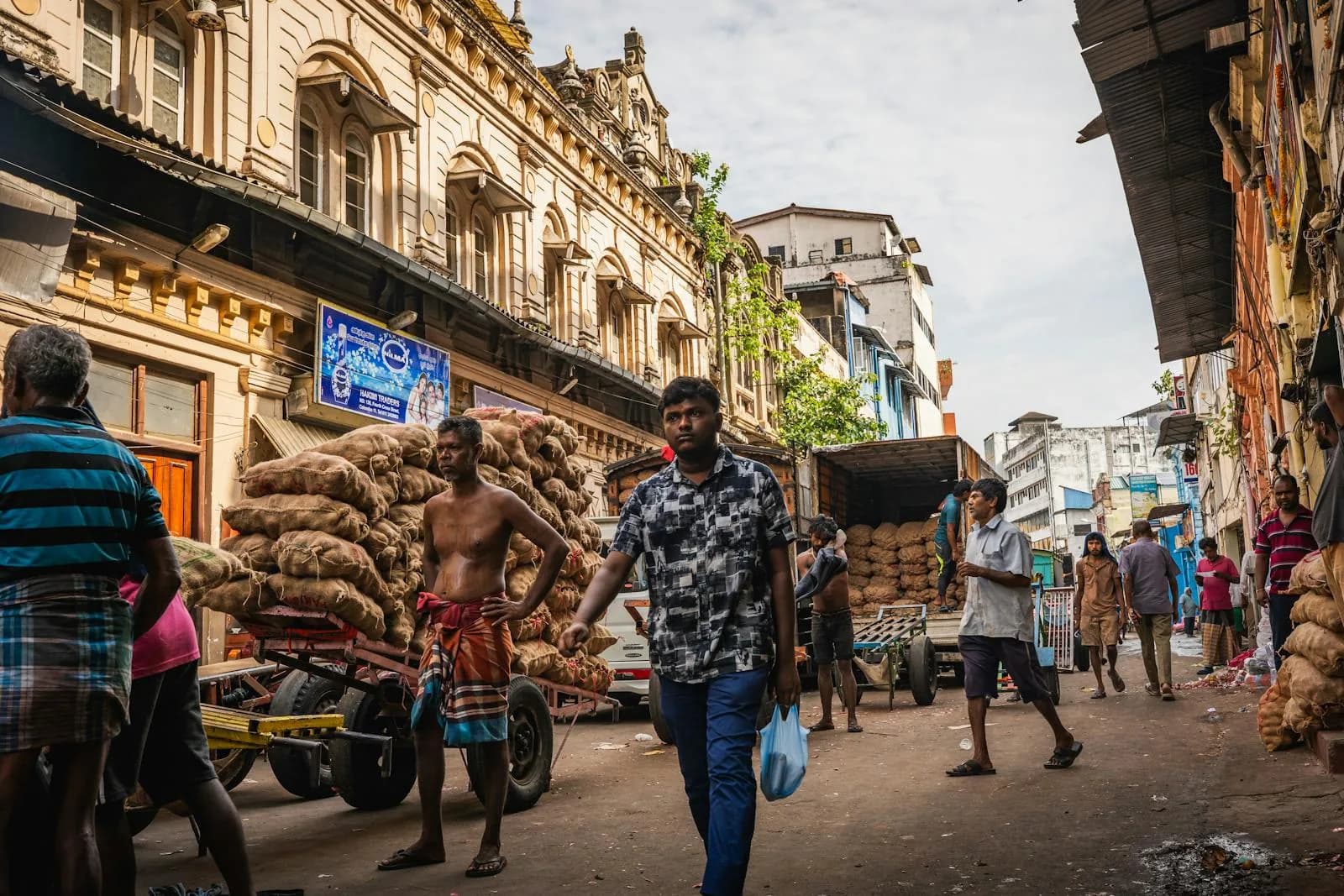 Busy market street in Colombo, Sri Lanka with locals and traders going about their day