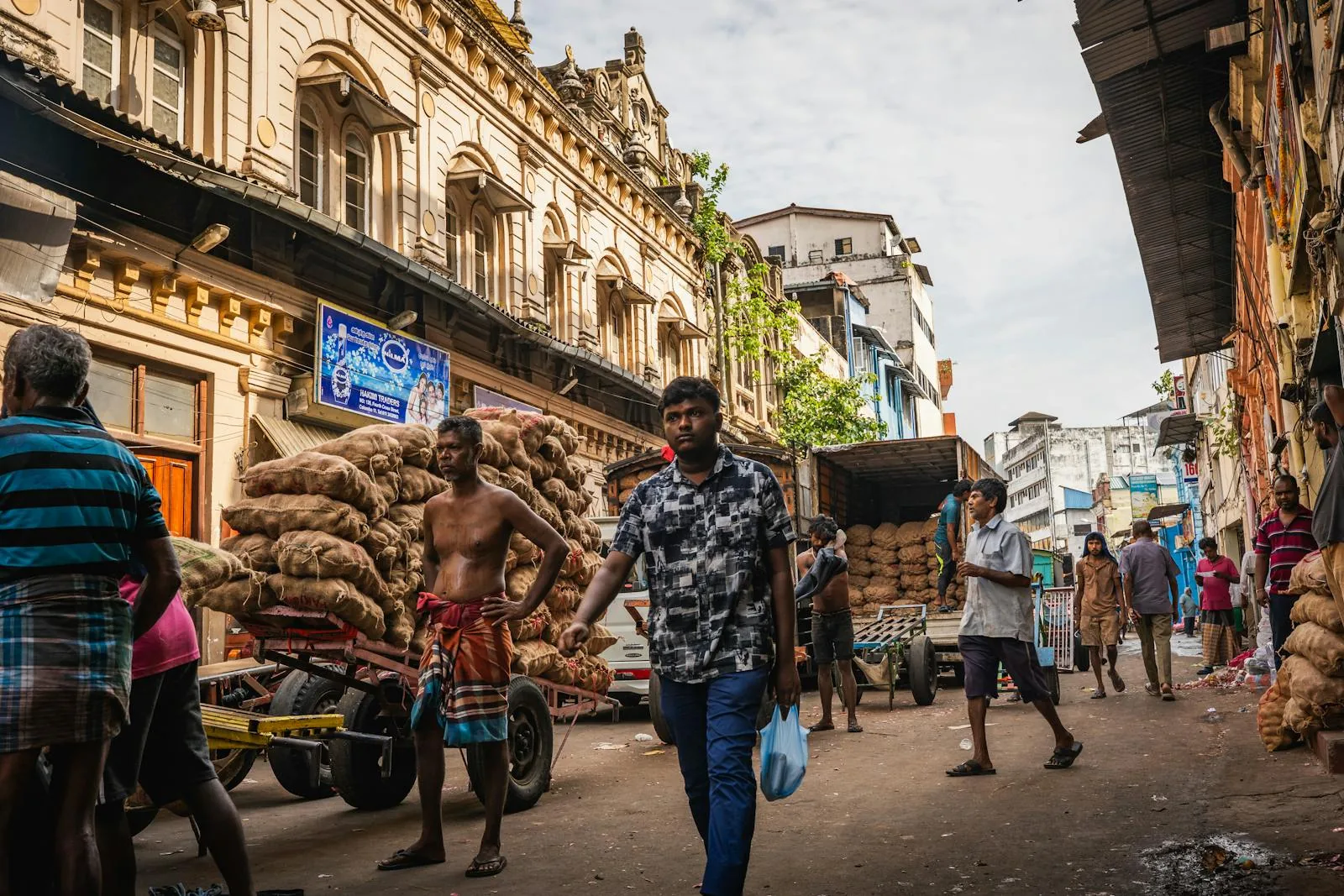 Busy market street in Colombo, Sri Lanka with locals and traders going about their day