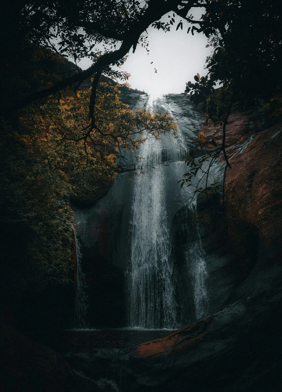 Deep jungle forest with a waterfall and river in Ella's hinterland - the natural setting of Ella Jungle Resort