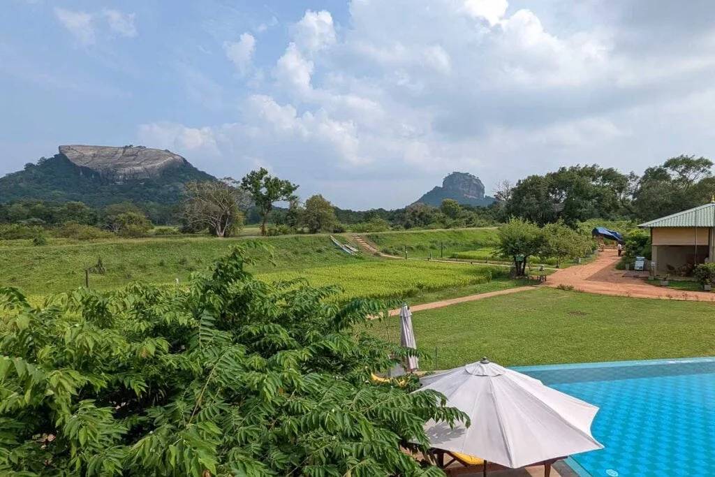 Sigiriya King's Resort pool with direct views of Sigiriya Rock Fortress rising from the Sri Lankan jungle - one of the most memorable pool settings in Sri Lanka