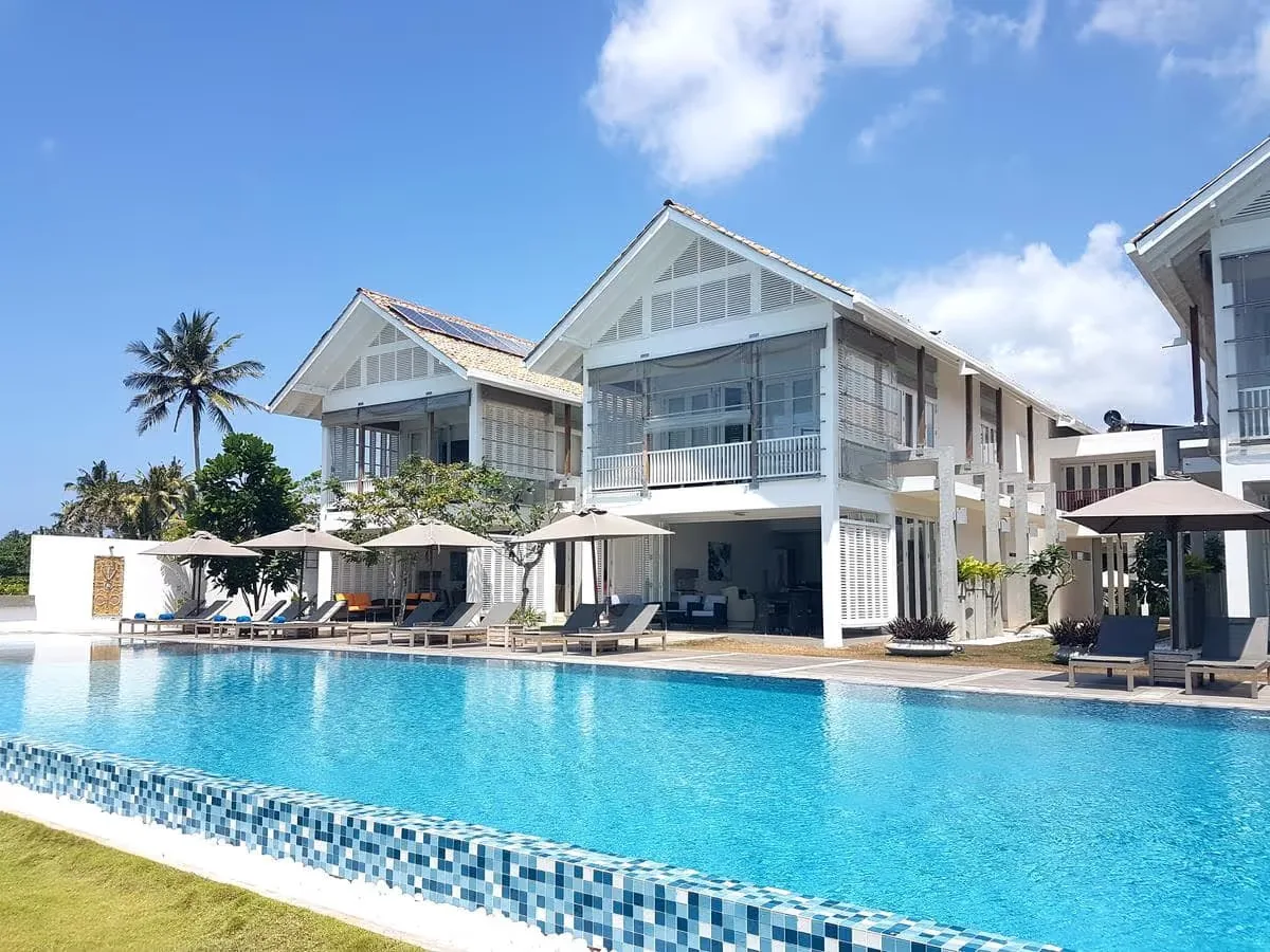 Sri Sharavi Beach Villas and Spa in Mirissa, Sri Lanka - modern beachfront suites perched above the Indian Ocean with a large outdoor swimming pool