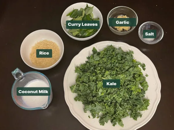 Ingredients for Kola Kanda herbal porridge laid out and labelled including rice, coconut milk, fresh herbs, garlic and salt