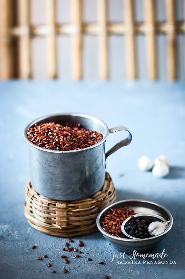 Unpolished Sri Lankan red rice in a bowl showing the characteristic reddish-brown colour of traditional heritage rice varieties used in Kola Kanda