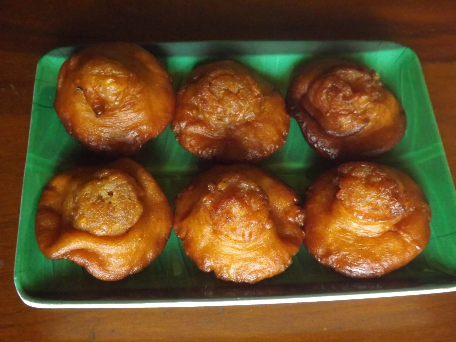 Konda Kavum - large shaped Sri Lankan Avurudu oil cakes with a distinctive topknot shape, arranged on a plate